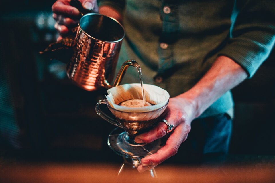 Hot water poured over ground coffee
