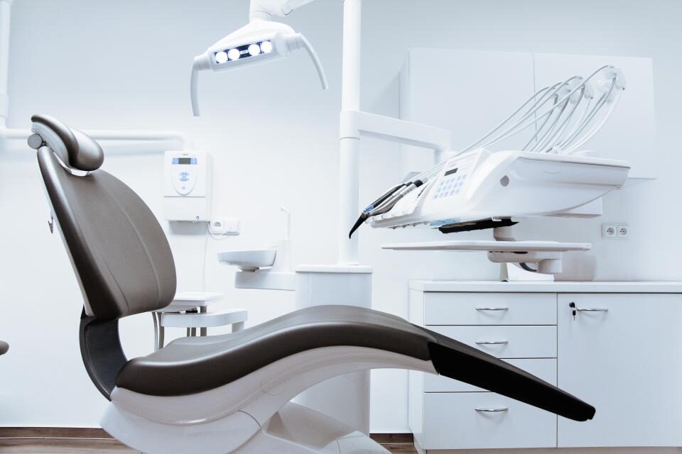 Dental chair in a bright treatment room