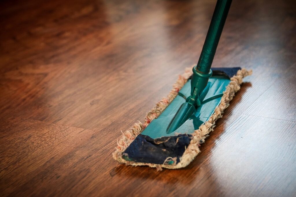 Mop on a wood floor after the rooms are cleared