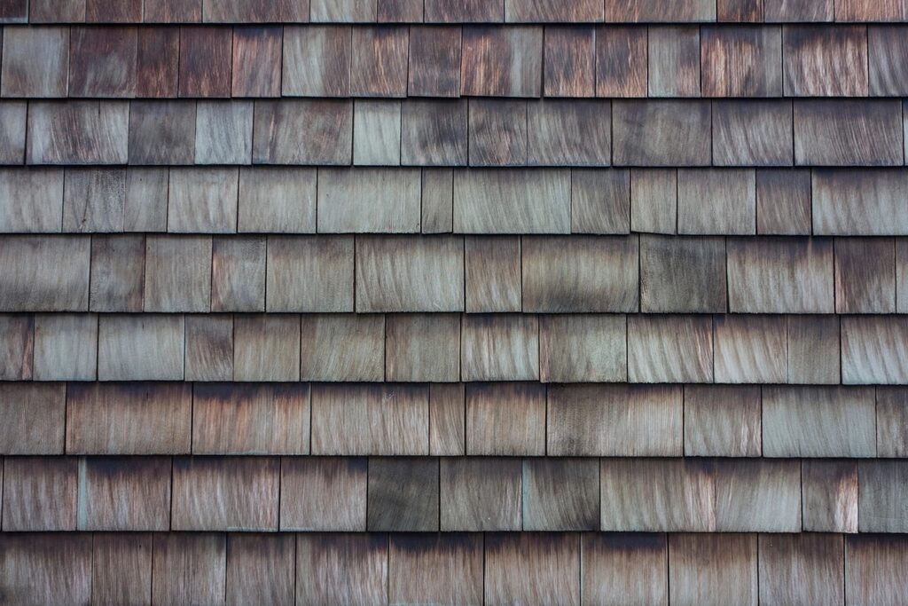 Weathered wood shingles in overlapping rows